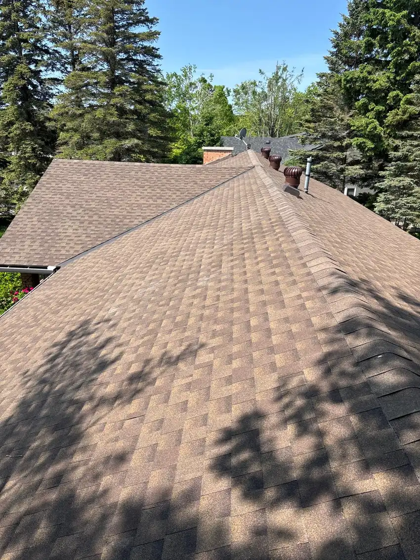 Roofing crew working on a residential roof